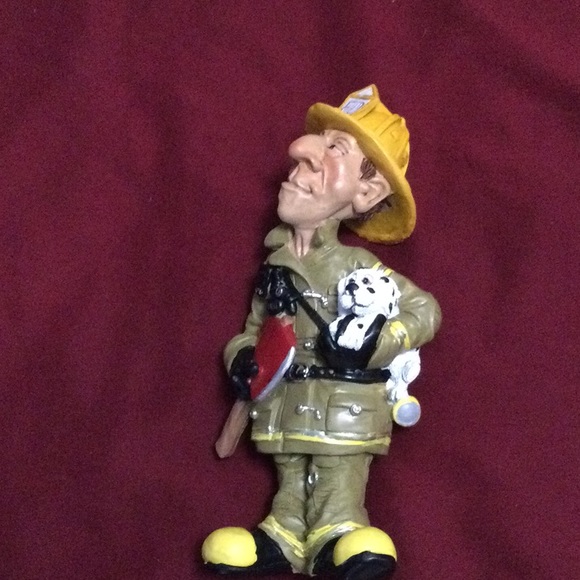 Fireman figuring funny with dog - Picture 3 of 5